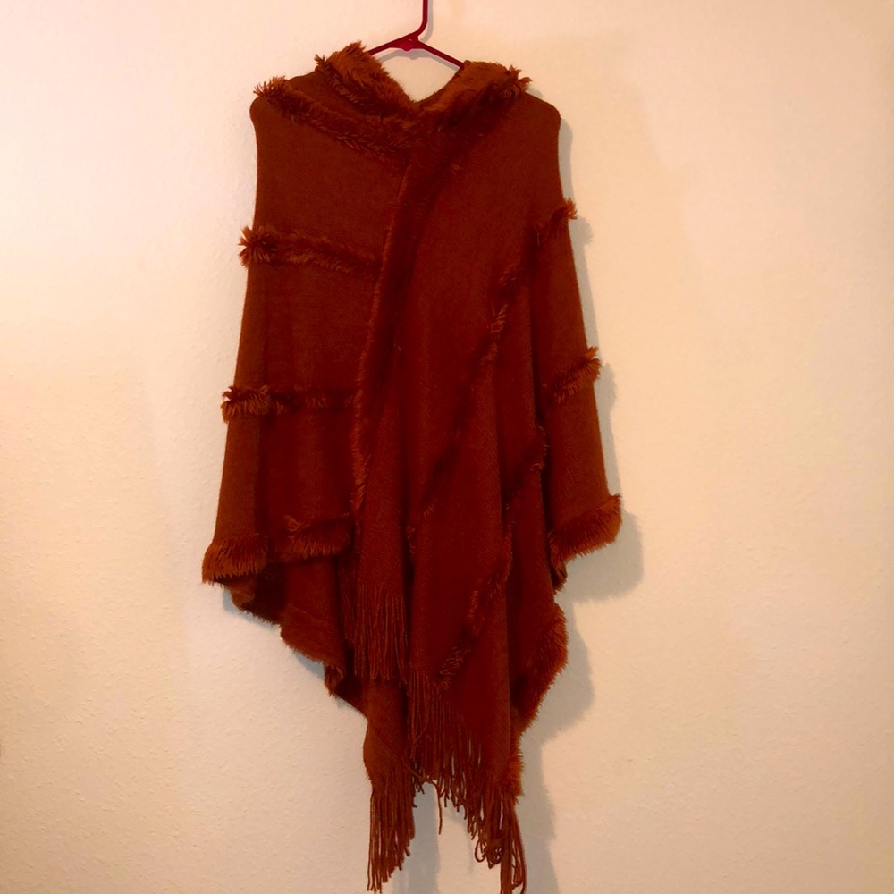 Women’s, L/XL shawl, never worn, excellent condition! Burnt orange in color.
